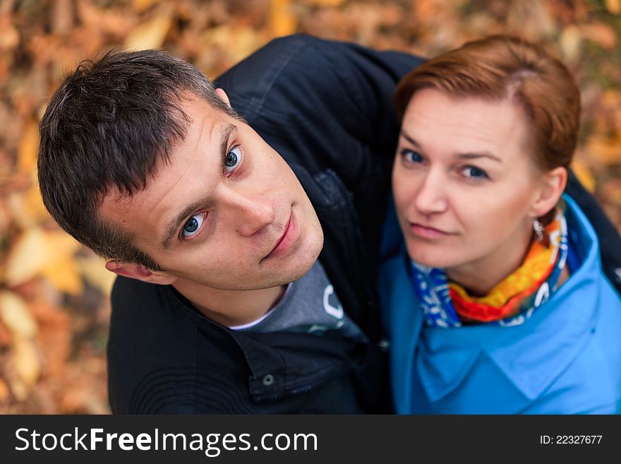 Happy Couple Standing Together in the Park During Autumn. Happy Couple Standing Together in the Park During Autumn