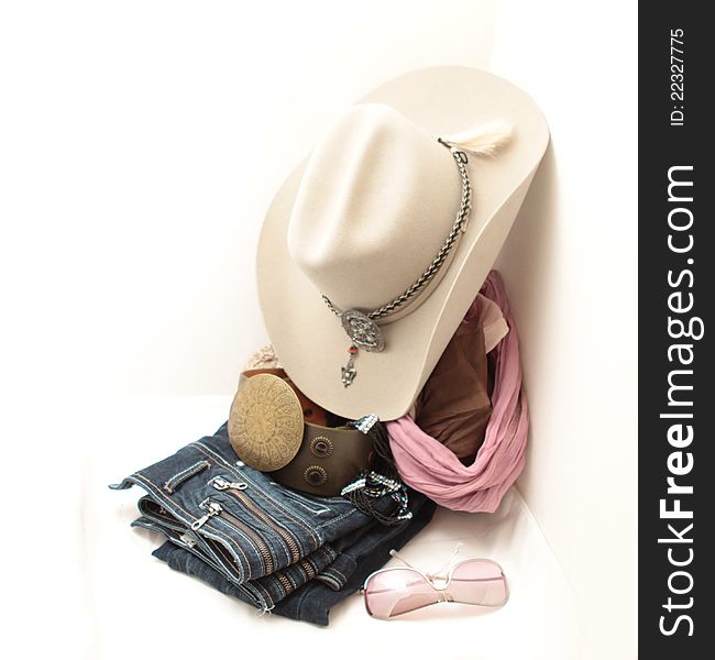 Stetson, boots and jeans on a white background. Stetson, boots and jeans on a white background