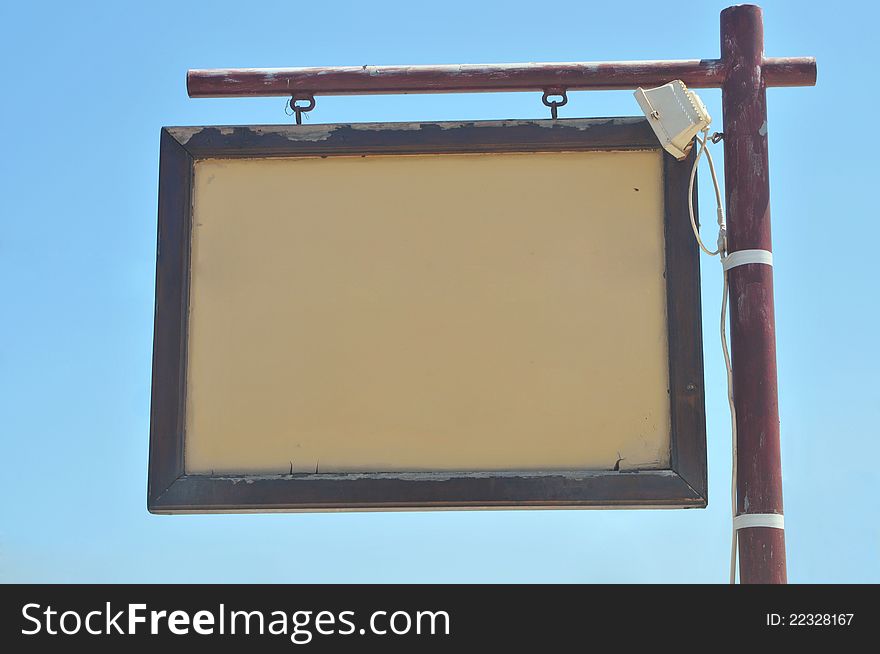 Used empty board in a wooden frame on a metal mount. Used empty board in a wooden frame on a metal mount