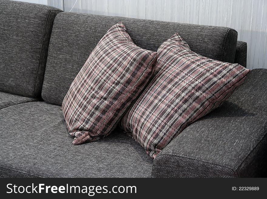 Pillows on the sofa.
Living room furniture with pillows.