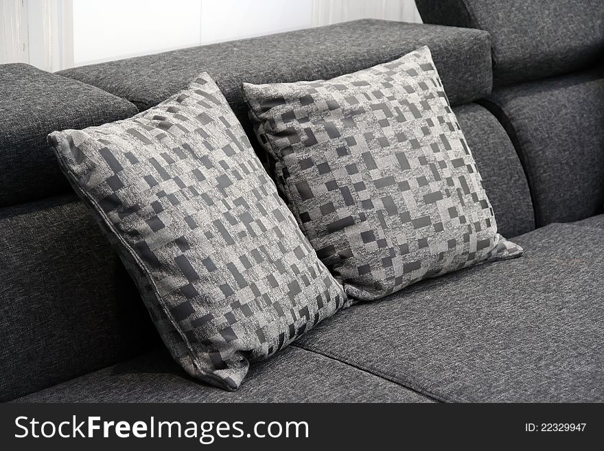 Pillows on the sofa.
Living room furniture with pillows.