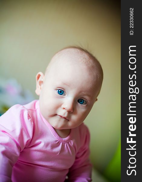 Little baby girl with blue eyes, in pink shirt. Little baby girl with blue eyes, in pink shirt