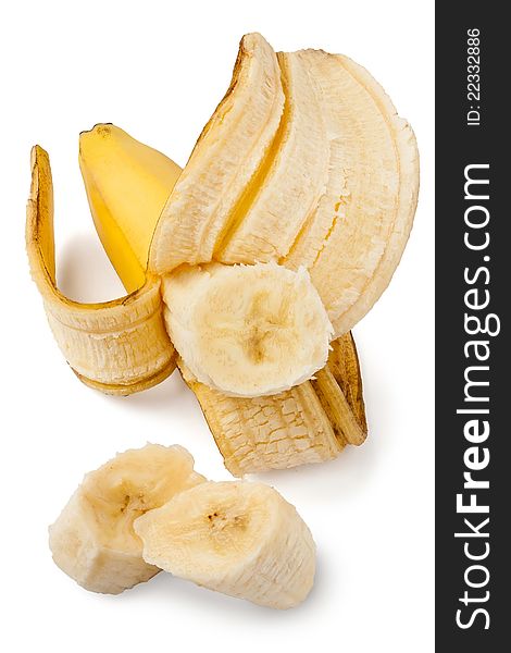 Peeled and cut banana against white background. Peeled and cut banana against white background