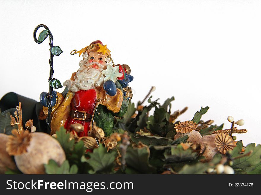 Santa Claus statue with xmas decoration isolated. Santa Claus statue with xmas decoration isolated