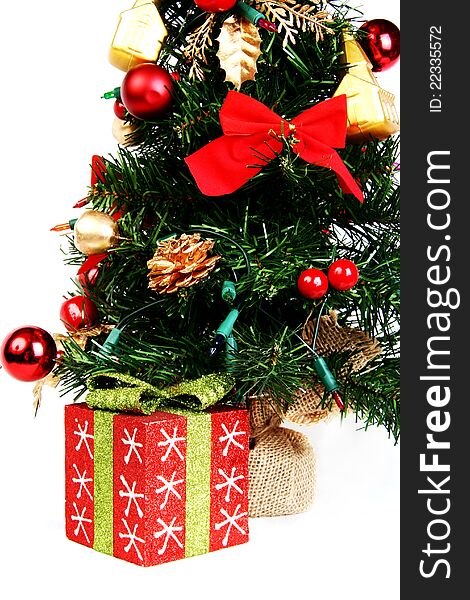 Present and Christmas tree on white background