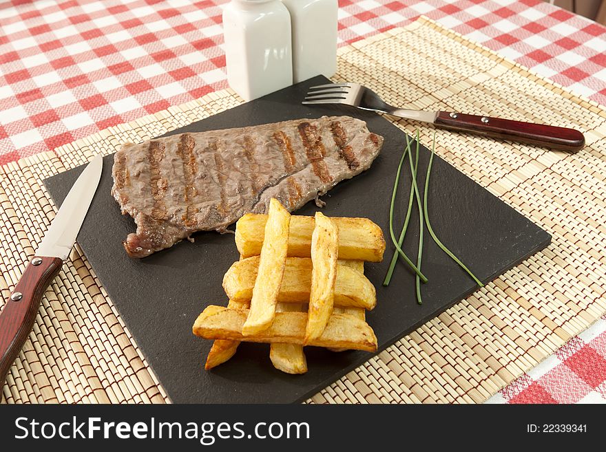 Beef steak grilled with chips