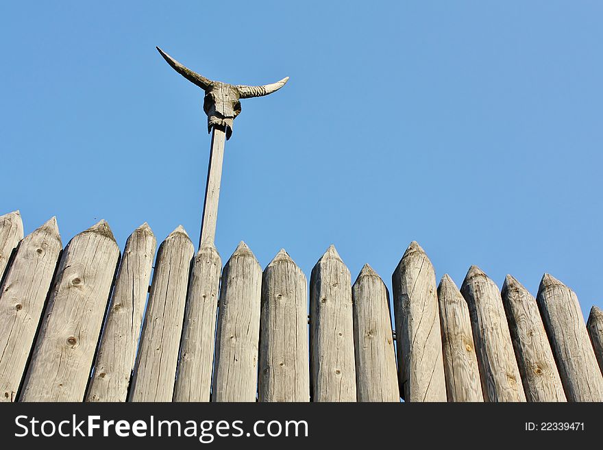 Medieval  wooden castle fence with decorations. Medieval  wooden castle fence with decorations