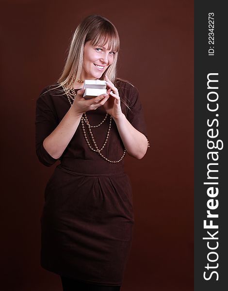 Fashion Woman On A Brown Background