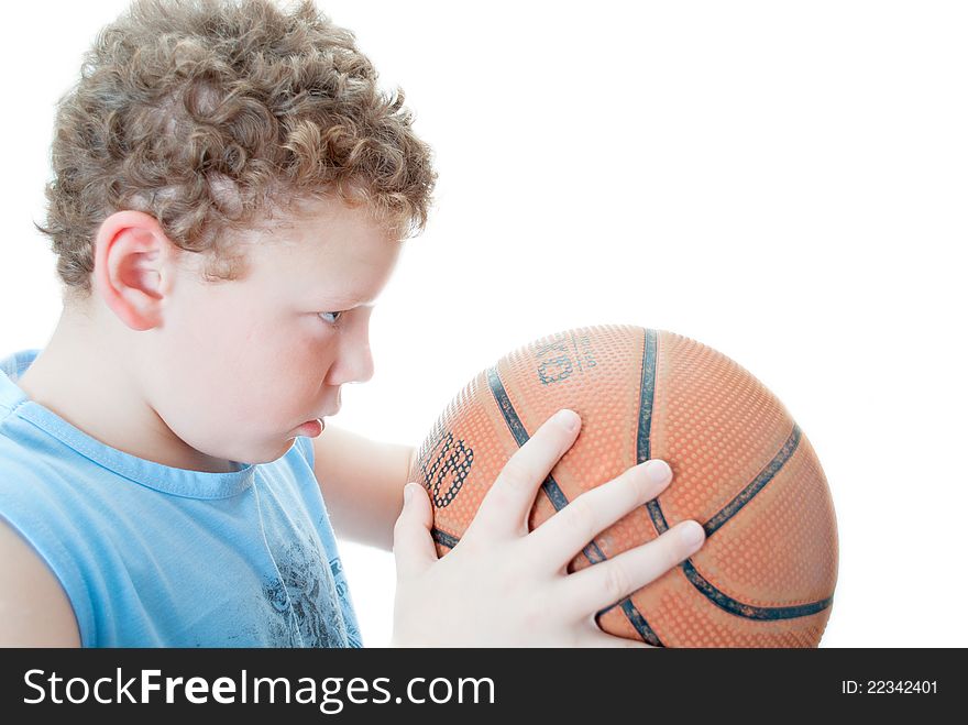 Boy with a basketball on a white background. Boy with a basketball on a white background