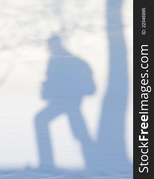 Shade of backpacker on snow. Shade of backpacker on snow
