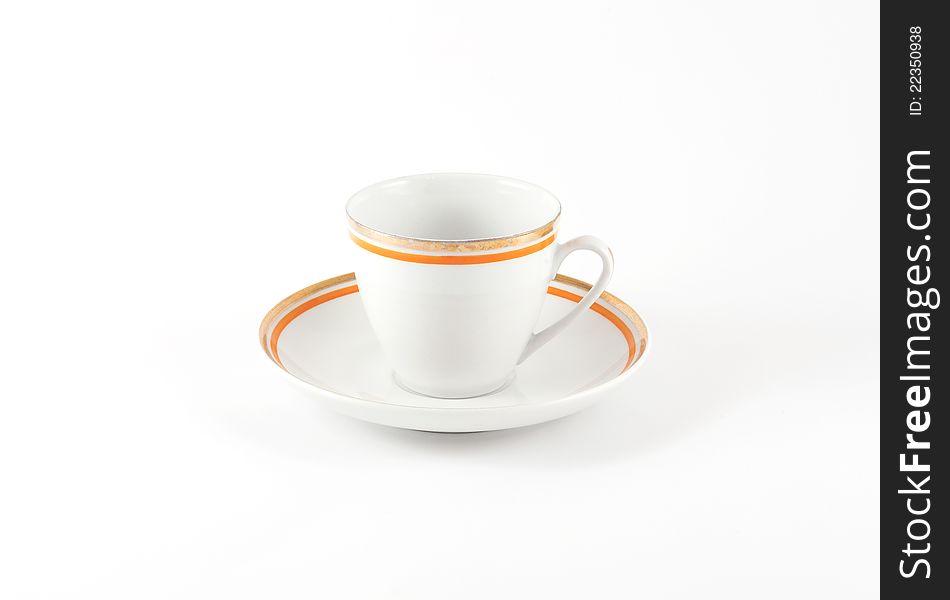 An old classic porcelain cup for tea or coffee isolated on white background.