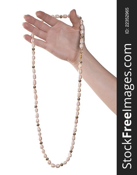 Necklace of pink pearls on hand