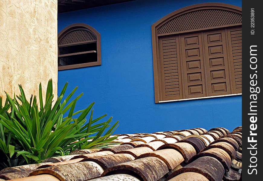 Blue wall with roof and window. Blue wall with roof and window