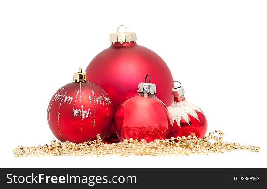 Four red Christmas balls with golden beads