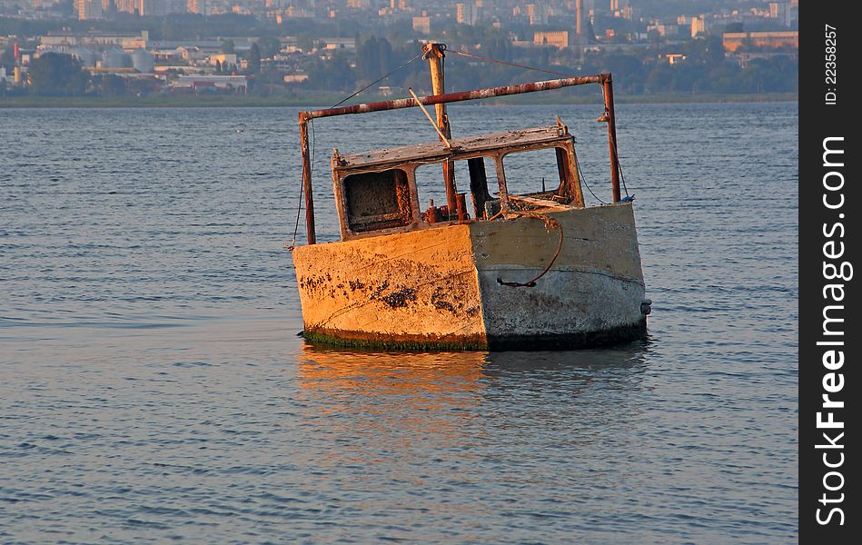 Boat sank in the lake near the town. Boat sank in the lake near the town