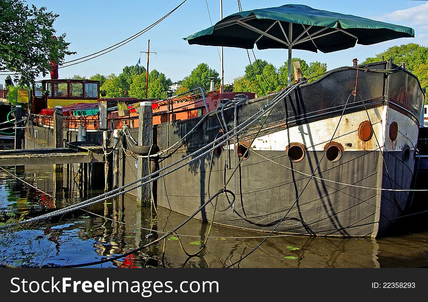 Barge docked. Photo taken in Amsterdam, Netherlands.