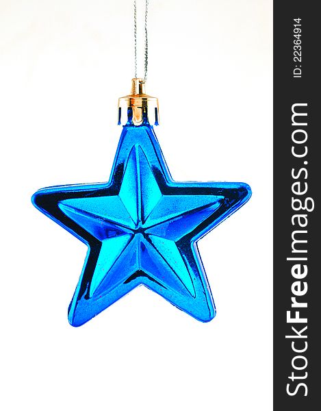 Blue five-pointed star toy Christmas tree against a white background. Blue five-pointed star toy Christmas tree against a white background