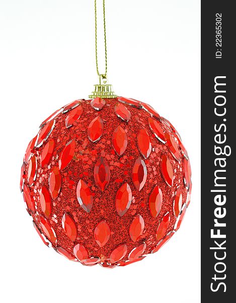 Red ball, Christmas decorations hanging on a golden thread against a white background. Red ball, Christmas decorations hanging on a golden thread against a white background