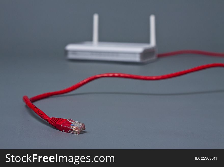 Ethernet cable coming from wireless router with double antenna