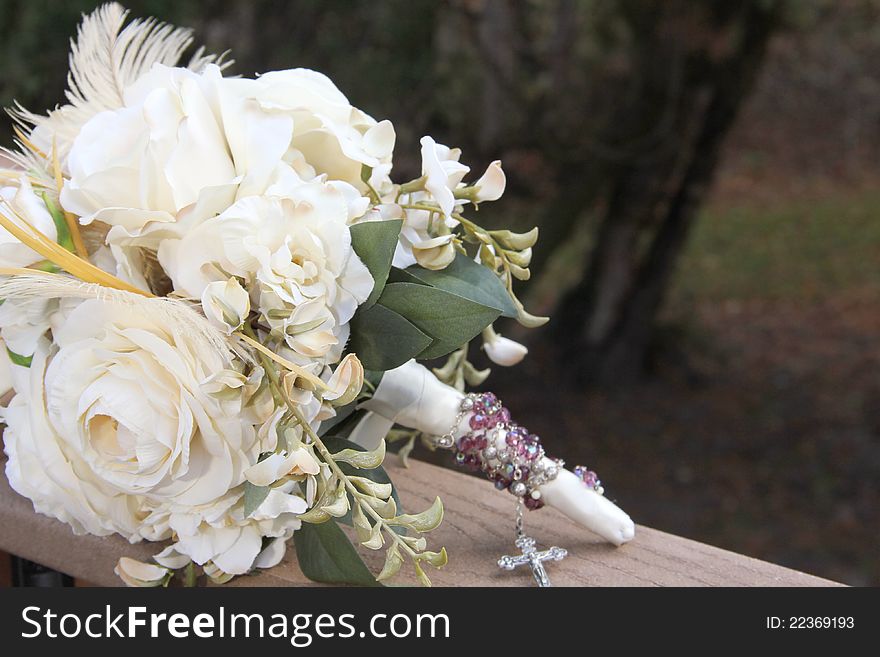 Feather and white rose bridal bouquet open space for wording or picture. Feather and white rose bridal bouquet open space for wording or picture