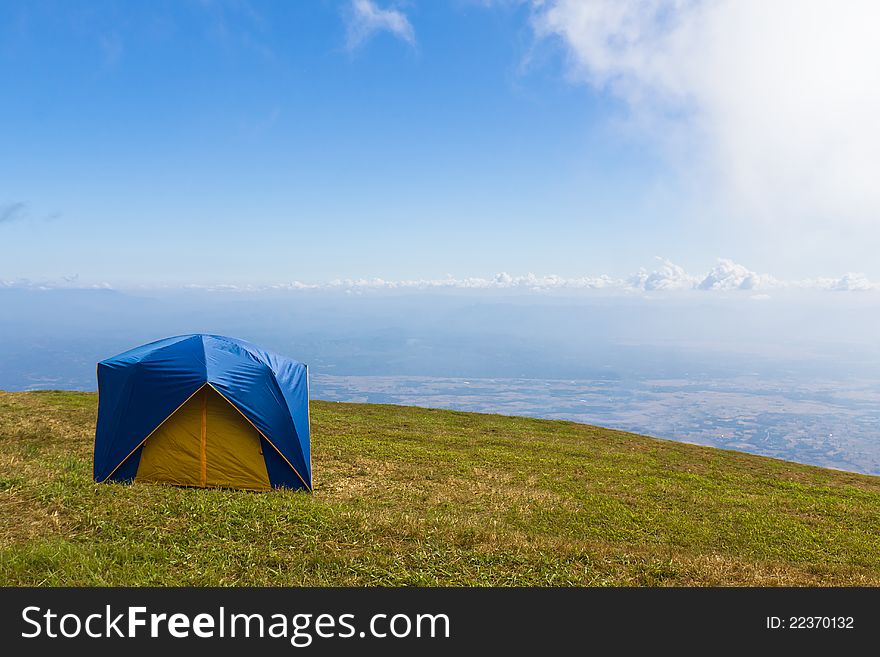 Tent on a grass under  blue sky