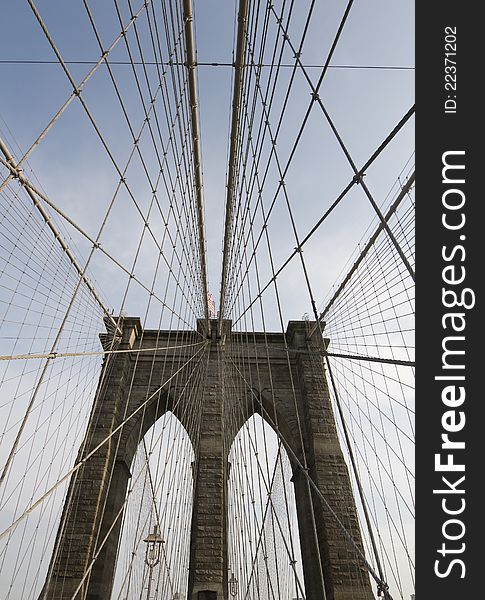 Vertical shot of suspension cables in Brooklyn Bridge exhibits intersting graphical patterns