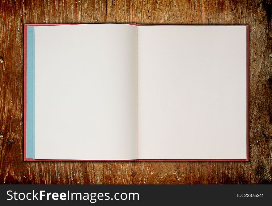 Book on old wooden background