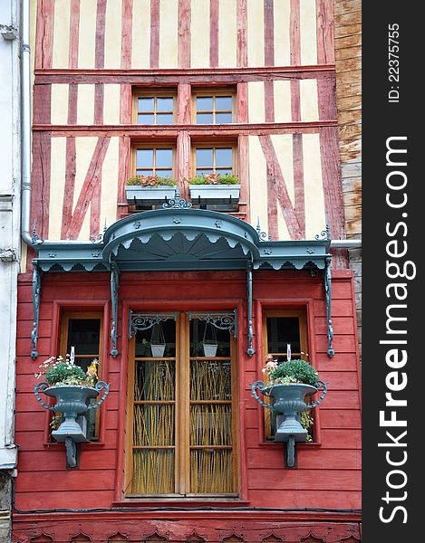 The front of a colourful building in the alsace region of france near the german border