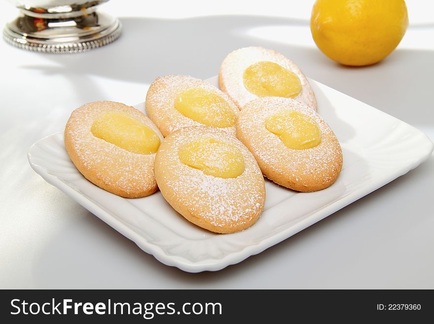 Delicious pastries whit lemon cream on white background. Delicious pastries whit lemon cream on white background