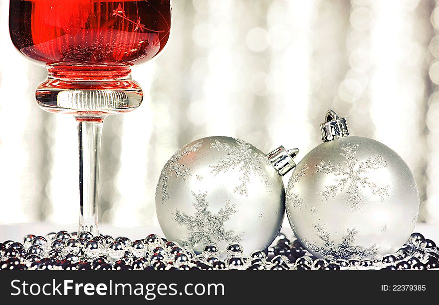 Red wine and christmas balls over abstract background. Red wine and christmas balls over abstract background