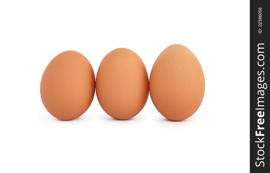 Three raw eggs on white background. Isolated with clipping path