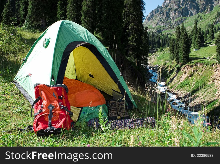Touristic  tent on mountain glade. Touristic  tent on mountain glade