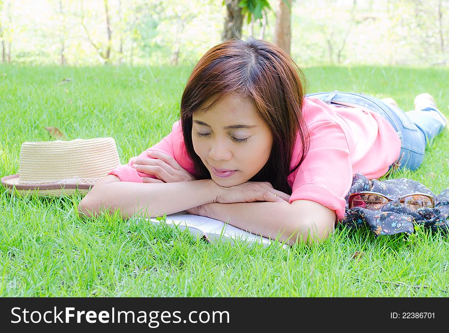 Thai Girl Sleeping On Grass