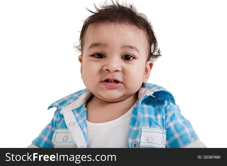 Adorable Indian baby laughing a over white background