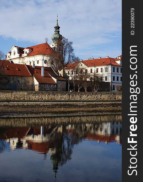 Brevnov monastery reflecting in water, Prague, Czech Republic