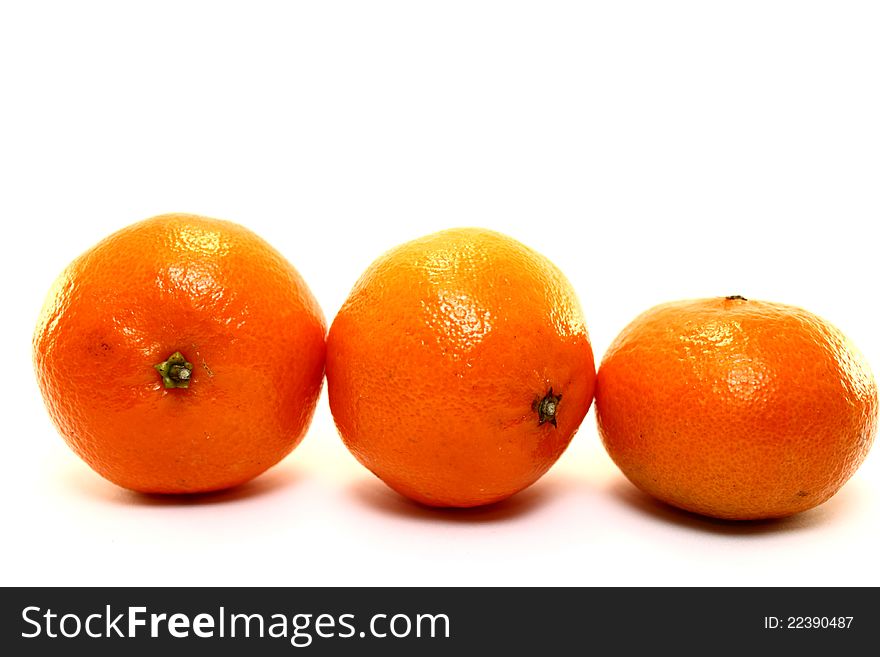 Three natural tangerine on white background. Three natural tangerine on white background
