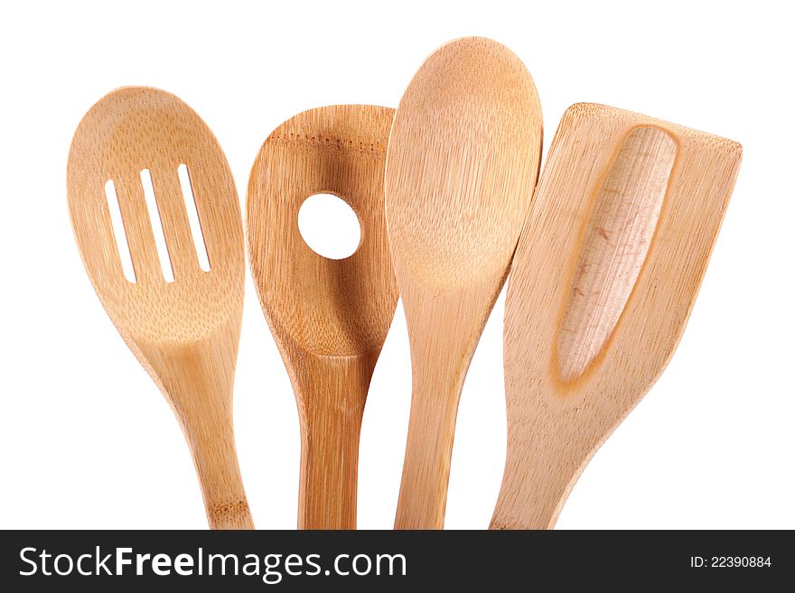 Wooden kitchen utensils isolated on white background