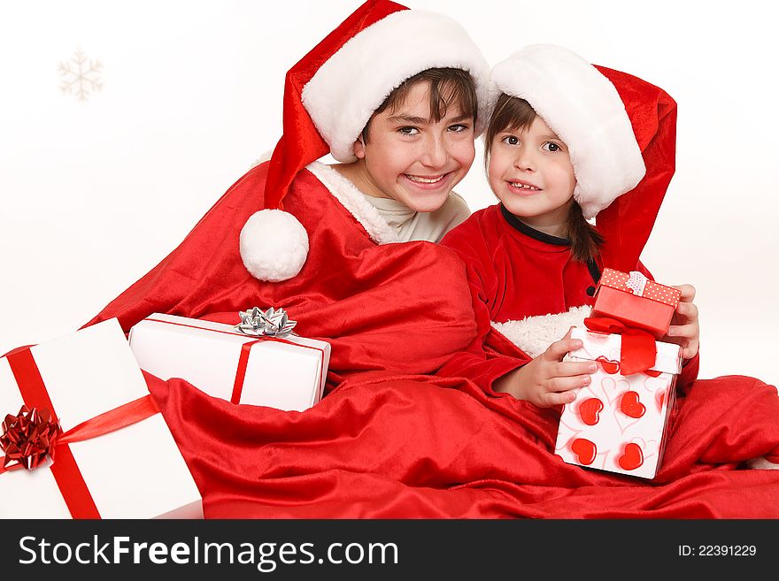 Brother and sister sitting with  gifts