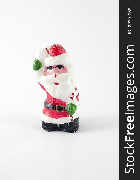 Santa candle figure on white background.