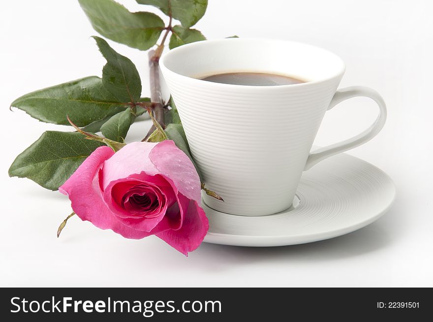 Bouquet of delicate pink roses in a cup on the table