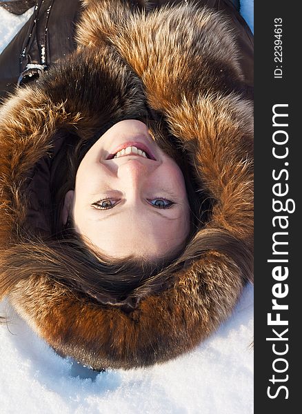 Winter portrait of young woman on snow. Winter portrait of young woman on snow