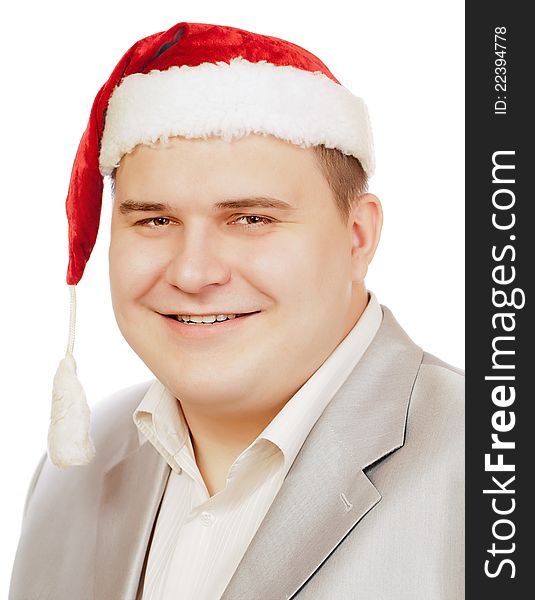 Young man in hat Santa Claus smiling at camera, isolated on white background. Young man in hat Santa Claus smiling at camera, isolated on white background.