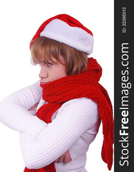 Angry girl with christmas hat and scarf over white. Angry girl with christmas hat and scarf over white