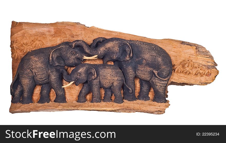 The teak wood was carved into a three elephant
