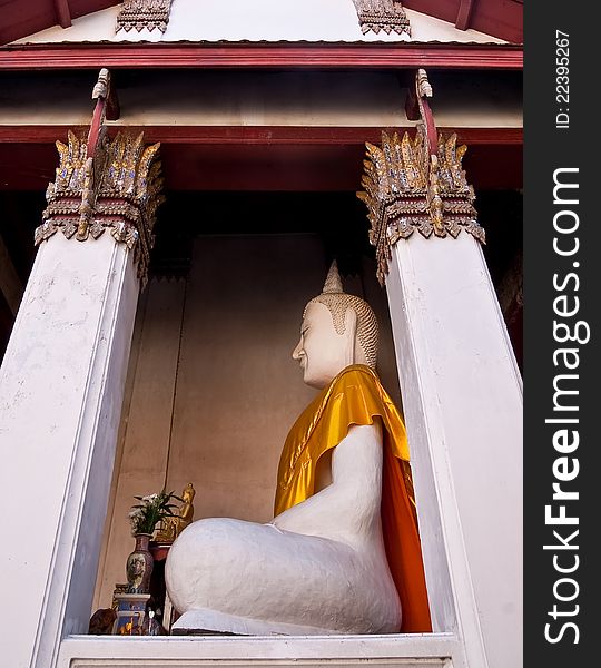 Old white buddha image in the temple , thailand