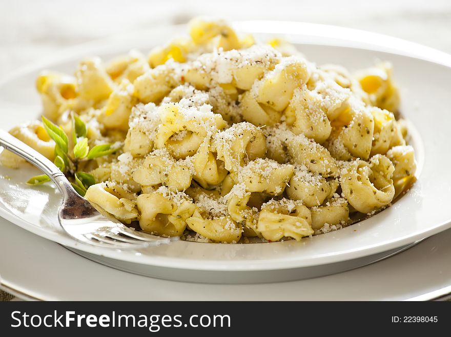 Close up Photograph of a Pesto Tortellini Meal. Close up Photograph of a Pesto Tortellini Meal