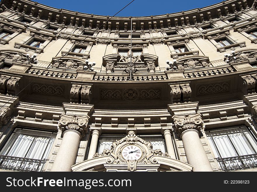 Italian old bank with a clock on the facade. Italian old bank with a clock on the facade