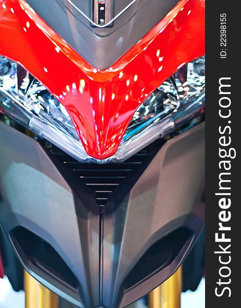 Motorcycle headlight in red color