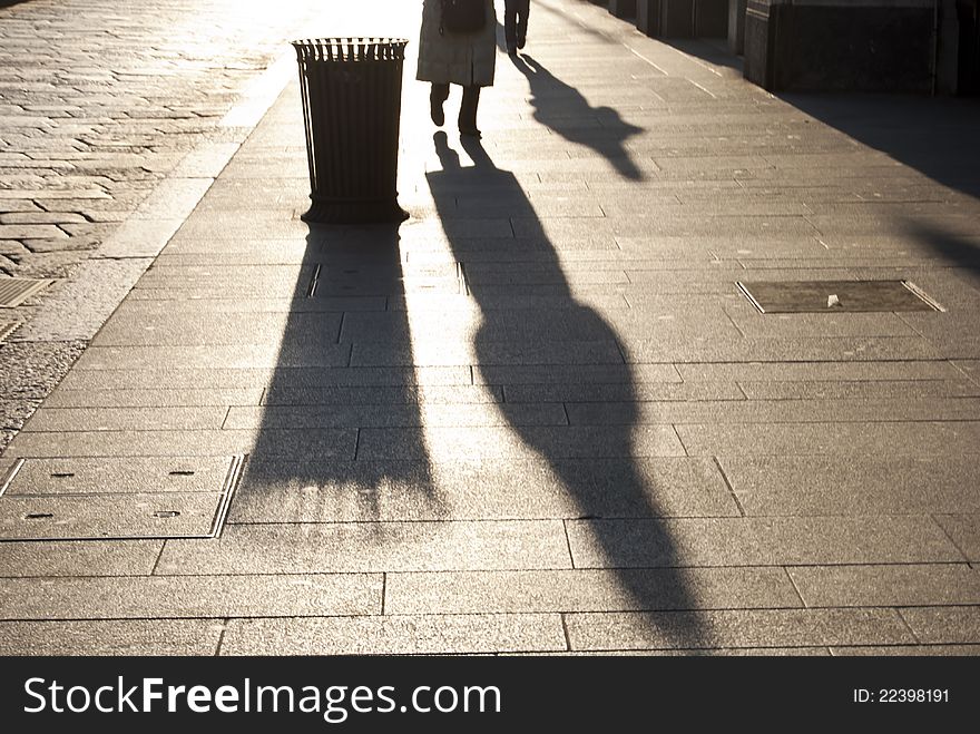 Sunset shot of two figures walking home. Sunset shot of two figures walking home.