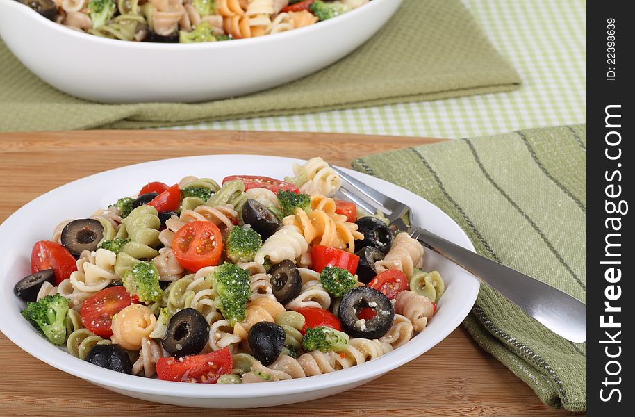 Pasta with black olives, tomatoes and broccoli. Pasta with black olives, tomatoes and broccoli